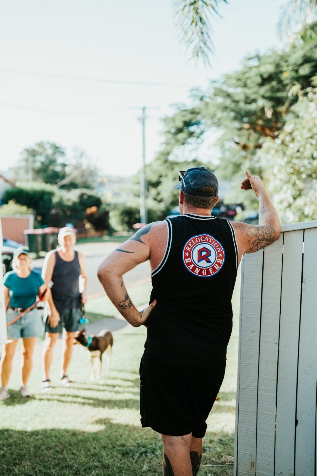 Relocation Rangers team member chatting with customers on a Brisbane suburban street